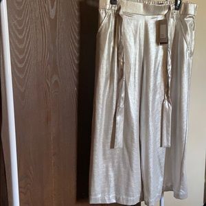 Silver cropped pants.